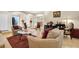 Spacious living room with an open floor plan, comfortable seating, and modern decor at 10907 Kewanee Dr, Temple Terrace, FL 33617