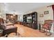Bright living room with hardwood floors, media center, and comfortable seating at 10907 Kewanee Dr, Temple Terrace, FL 33617