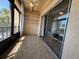 Enclosed sunroom featuring tile flooring, ceiling fan, views of the community and access from sliding glass doors at 11485 Oakhurst Rd # 319, Largo, FL 33774