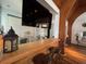 Inviting bar area with counter seating and a large-screen TV, ideal for relaxation and entertainment at 11485 Oakhurst Rd # 319, Largo, FL 33774