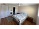 Comfortable bedroom with hardwood floors, neutral walls, and natural light at 11485 Oakhurst Rd # 319, Largo, FL 33774
