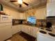 Well-equipped kitchen with stainless steel appliances and ample cabinet space, designed for functionality and style at 11485 Oakhurst Rd # 319, Largo, FL 33774