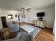 Inviting living room with hardwood floors, ceiling fan, and classic furniture at 11485 Oakhurst Rd # 319, Largo, FL 33774