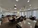 A recreation center meeting room with tables, chairs, and light blue walls at 11485 Oakhurst Rd # 319, Largo, FL 33774