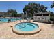 Outdoor pool and hot tub with seating around, in a quiet and scenic neighborhood at 11485 Oakhurst Rd # 319, Largo, FL 33774