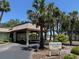 Exterior view of the Recreation Center with a sign and palm trees at 11485 Oakhurst Rd # 319, Largo, FL 33774