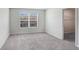 Bright bedroom featuring a window view, closet and soft gray carpeting at 11718 Blackbrook Ct, Seffner, FL 33584