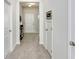 Foyer with tile flooring leading to a white paneled front door; a side door provides easy access at 11718 Blackbrook Ct, Seffner, FL 33584
