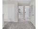 Hallway with gray carpet, closet and views into adjacent rooms at 11718 Blackbrook Ct, Seffner, FL 33584