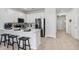 This modern kitchen with stainless steel appliances and quartz countertops is great for entertaining at 11718 Blackbrook Ct, Seffner, FL 33584
