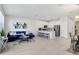 Open-concept design featuring a living room, kitchen with bar seating, and a dining area at 11718 Blackbrook Ct, Seffner, FL 33584