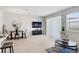 Bright open-concept living space with dining area, neutral tile flooring, and modern decor at 11718 Blackbrook Ct, Seffner, FL 33584