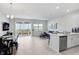 Open-concept living room and kitchen feature ample natural light and access to the backyard at 11718 Blackbrook Ct, Seffner, FL 33584