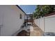 This home offers a serene backyard setting, enhanced by a screened-in patio and a crisp white fence for added privacy at 1204 Croydonwood Cir, Brandon, FL 33510