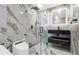 Modern bathroom with sleek black fixtures, marble walls, glass enclosed shower, and smart toilet at 1204 Croydonwood Cir, Brandon, FL 33510