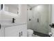 Renovated bathroom with glass shower, marble tile and new fixtures at 1204 Croydonwood Cir, Brandon, FL 33510