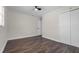 Bedroom features hardwood floors, a ceiling fan, and standard closet with ample space at 1204 Croydonwood Cir, Brandon, FL 33510