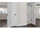 Hallway featuring doors and dark wood-look floors at 1204 Croydonwood Cir, Brandon, FL 33510