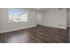 Bright living room with large windows and dark wood-look floors at 1204 Croydonwood Cir, Brandon, FL 33510