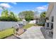 View of an outdoor grill, trampoline, and lush lawn in the backyard of this home at 13528 Woodside Dr, Hudson, FL 34667