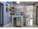 Home bar area with stone accents, wine storage, and glass shelving at 13528 Woodside Dr, Hudson, FL 34667