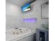 Close up of jacuzzi tub, modern lighting, vessel sink and updated bathroom fixtures at 13528 Woodside Dr, Hudson, FL 34667