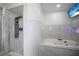 Luxurious bathroom with a glass shower and a soaking tub, designed for relaxation and comfort at 13528 Woodside Dr, Hudson, FL 34667