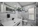 Beautiful bathroom showcasing modern sink and vanity, along with luxurious tile finishes, offering a blend of style and comfort at 13528 Woodside Dr, Hudson, FL 34667