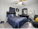 Inviting bedroom with a plush bed, dark wood furniture, and a serene atmosphere at 13528 Woodside Dr, Hudson, FL 34667