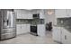 Stylish kitchen with stainless steel appliances, granite countertops, and a decorative backsplash, perfect for modern living at 13528 Woodside Dr, Hudson, FL 34667