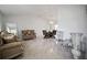 Open living room showcasing tile floors, neutral walls, and elegant furnishings for a modern touch at 13528 Woodside Dr, Hudson, FL 34667