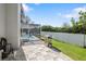 View of pool with screened enclosure, patio, and outdoor grill in the backyard at 13528 Woodside Dr, Hudson, FL 34667