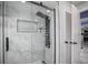 Luxurious shower featuring sleek glass enclosure, designer tile and multi-setting shower system, offering a spa-like experience at 13528 Woodside Dr, Hudson, FL 34667