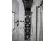 Contemporary shower features a sleek, modern, multi-setting shower system accented by minimalist tile design at 13528 Woodside Dr, Hudson, FL 34667