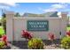 Entrance sign for Millwood Village displaying the community name and restrictions at 13528 Woodside Dr, Hudson, FL 34667