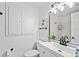 Bathroom featuring vanity with modern fixtures and plenty of cabinet space at 1499 Janet Pl, Englewood, FL 34223