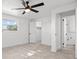 Bedroom featuring tile floors, a ceiling fan, and two windows at 1499 Janet Pl, Englewood, FL 34223