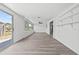 Bonus room featuring laminate floors, sliding glass door, and fan at 1499 Janet Pl, Englewood, FL 34223