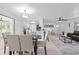 Bright and open living space with a seamless flow between the living, dining, and kitchen areas, perfect for entertaining at 1499 Janet Pl, Englewood, FL 34223