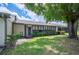 Lush backyard with large trees and a screened-in lanai at 150 James Ct, Oldsmar, FL 34677