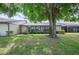 Large backyard with mature trees and a spacious patio area at 150 James Ct, Oldsmar, FL 34677