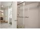 Clean and efficient bathroom featuring a glass door shower and white tile at 150 James Ct, Oldsmar, FL 34677
