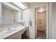 Bathroom featuring a vanity with sink, a mirrored medicine cabinet, and access to the toilet/shower room at 150 James Ct, Oldsmar, FL 34677
