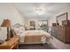 Comfortable bedroom with carpet, ceiling fan and a large window providing natural light at 150 James Ct, Oldsmar, FL 34677