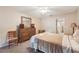 Cozy bedroom with a plush bed, dresser, and view of the ensuite bathroom, offering comfort and privacy at 150 James Ct, Oldsmar, FL 34677