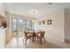 Bright dining area with tile floors and a view of the exterior through shuttered doors at 150 James Ct, Oldsmar, FL 34677