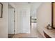 Hallway showcasing tile flooring, coat closet, and an open view into the living spaces at 150 James Ct, Oldsmar, FL 34677