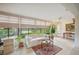 Bright living room featuring tile floors, a comfortable sofa, and scenic water views at 150 James Ct, Oldsmar, FL 34677