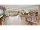 Inviting living room with lake views, neutral decor, and a mirrored wall enhancing spaciousness at 150 James Ct, Oldsmar, FL 34677