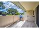 Relax on the private patio, perfect for grilling with the included barbecue on wood-look plank flooring at 150 James Ct, Oldsmar, FL 34677